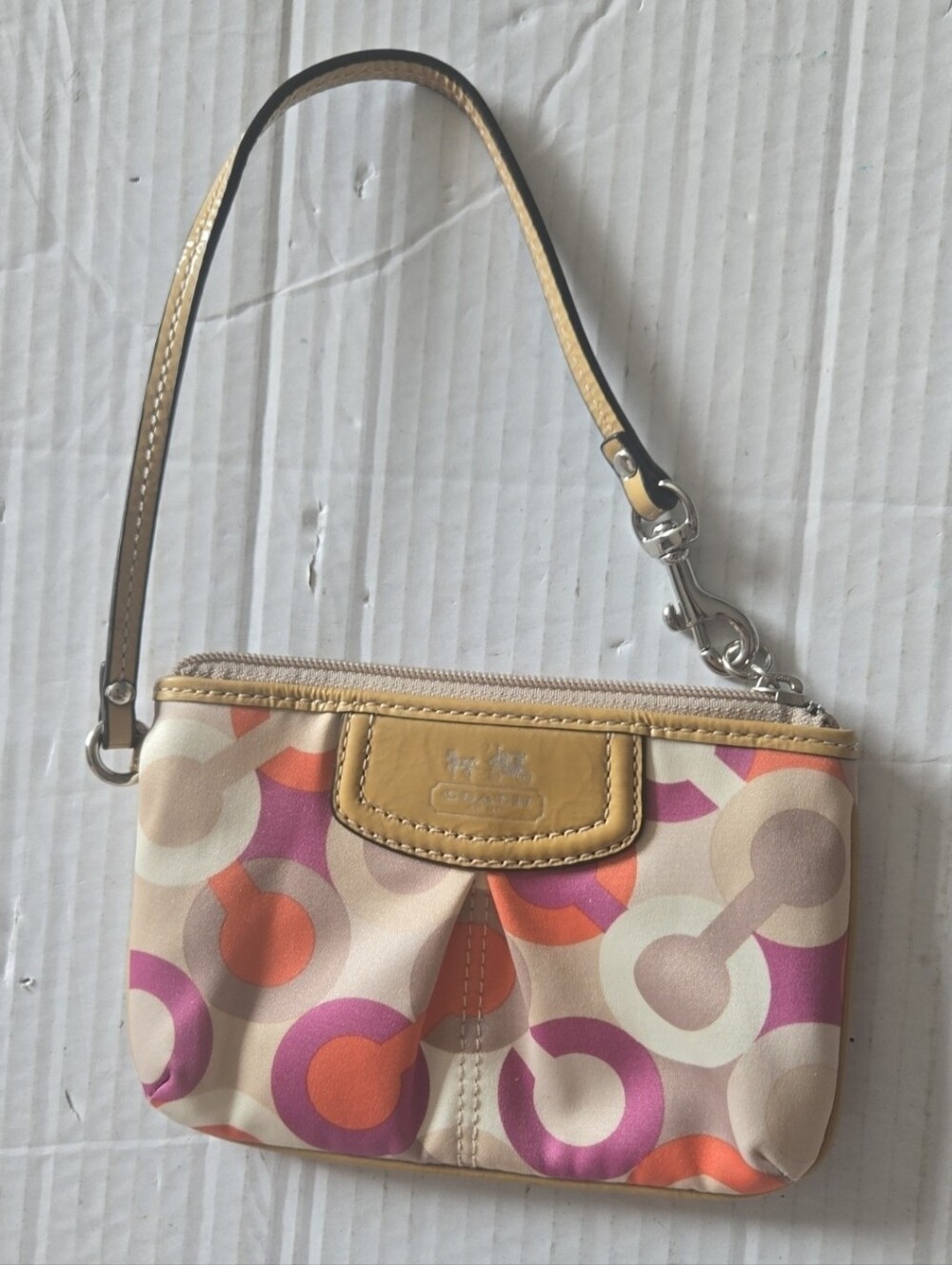 Coach Multicolor Circle Signature Wristlet Phone Case in Beige, Pink, Orange